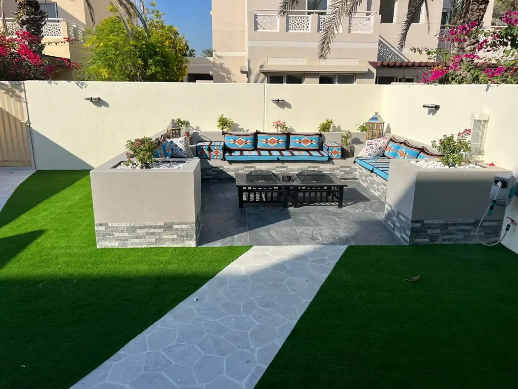 Outdoor seating area with landscaping and greenery, Dubai villa project by MasterMaint