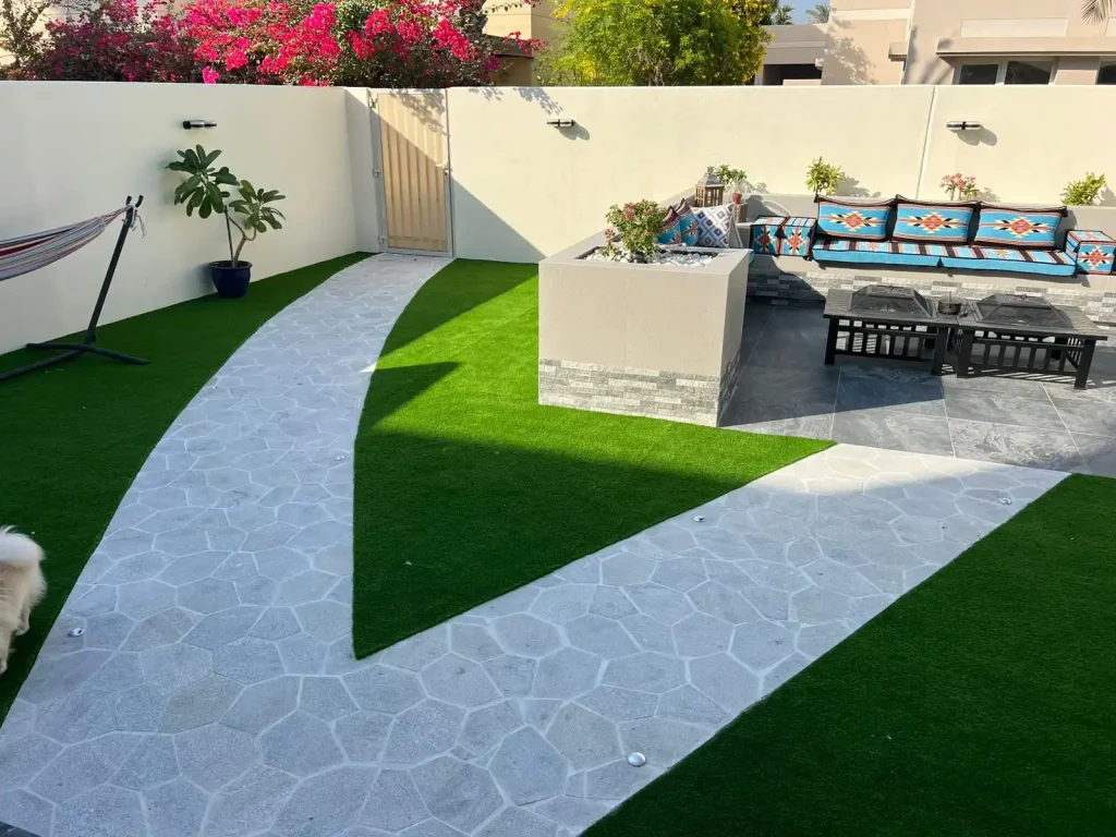 Villa outdoor pergola and paved seating area landscaped by MasterMaint in Dubai
