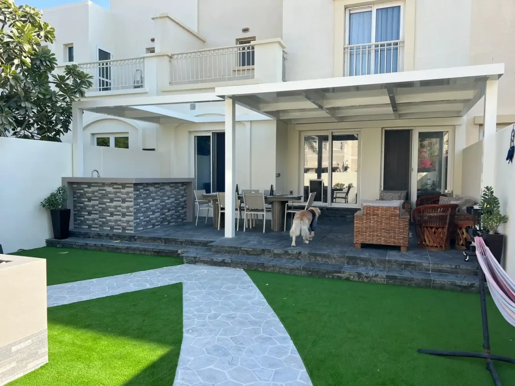 Custom landscaped garden with artificial grass and stone pathway in Dubai villa