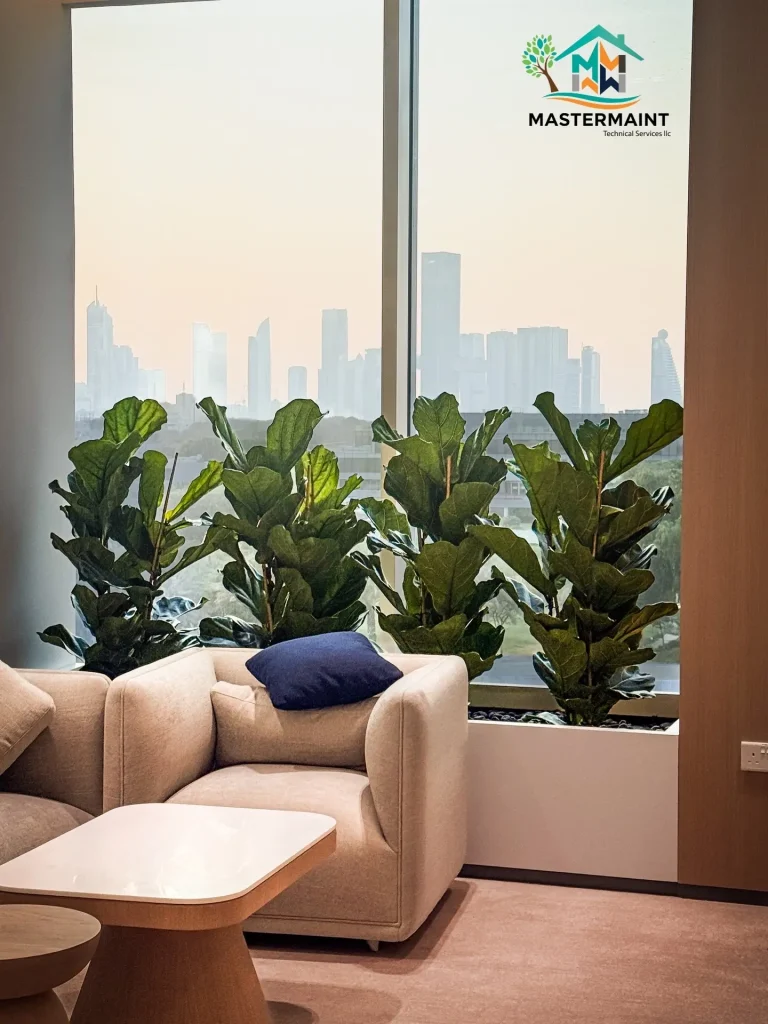 Maintained living green wall installation in a Dubai apartment living room with skyline view