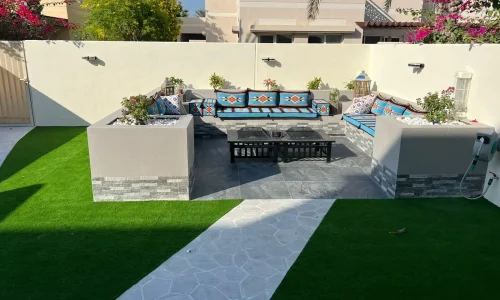 Outdoor seating area with landscaping and greenery, Dubai villa project by MasterMaint