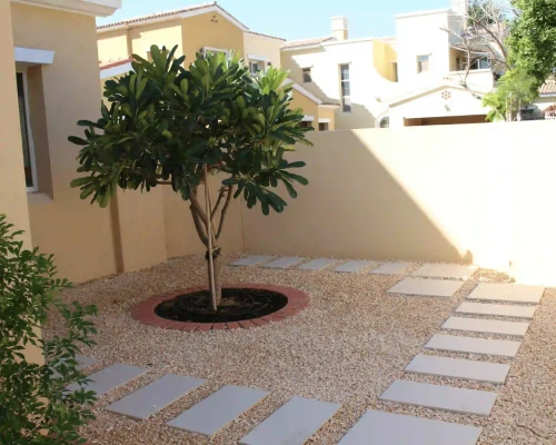 Landscape Design 5 Stone pathway and paved walkway with decorative gravel and retaining wall in a Dubai villa garden