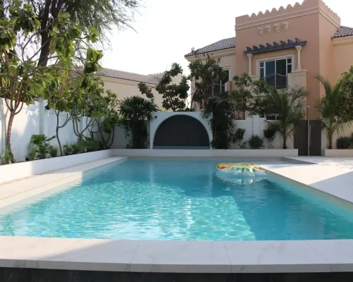 Landscaped garden pathway with flowering plants in a Dubai villa, MasterMaint project